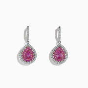 Experience elegance with these 14K two-tone gold drop earrings featuring pear-shaped pink sapphires and sparkling diamonds, totaling 2.73 carats. Perfectly crafted for a touch of luxurious sophistication.