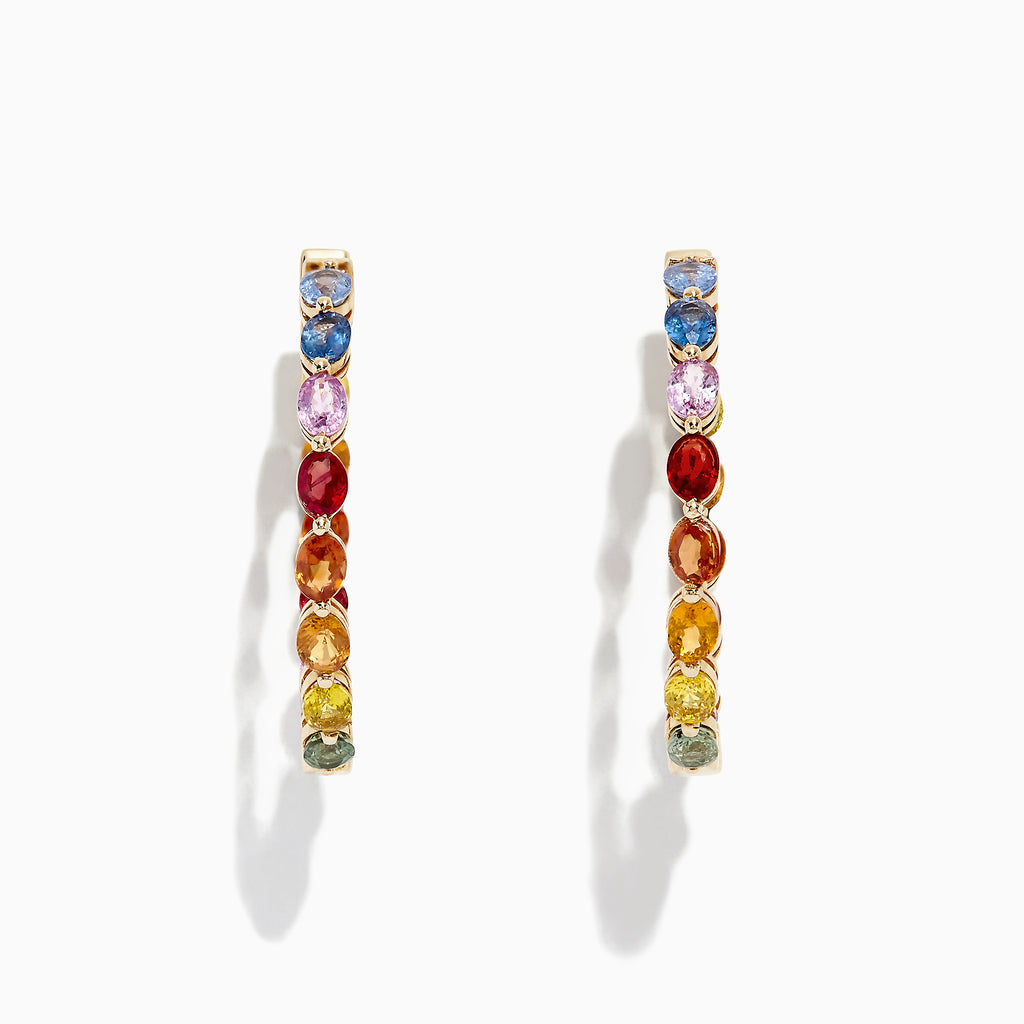 The Watercolors 14K Yellow Gold Multi Sapphire 1 Hoop Earrings (6.18 TCW) feature a rainbow arrangement of sapphires and are shown against a white background with a subtle shadow.