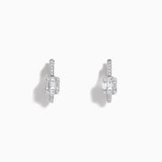 The Classique 14K White Gold Diamond 1/2 Huggie Earrings (0.49 TCW) feature elegant rectangular emerald-cut and round diamonds set in white gold hoops, displayed on a white background.