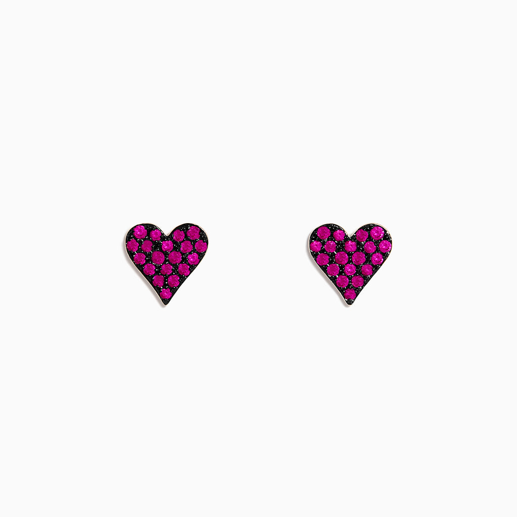 A pair of 14K Rose Gold Ruby Pave Heart Stud Earrings with bright pink gemstones is shown on a plain white background.