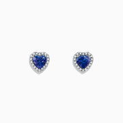 Nahla Siri 14K White Gold Tanzanite and Diamond Heart Earrings, 1.51 TCW, feature heart-shaped blue tanzanite gems bordered by sparkling diamonds. Shown on a plain white background.