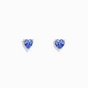 The Nahla Siri Sterling Silver Heart Shaped Tanzanite Stud Earrings are shown displayed on a plain white background.