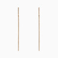 The DOro 14K Yellow Gold Diamond Vertical Drop Earrings feature a minimalist, elegant design with a single row of sparkling diamonds totaling 0.35 TCW, shown against a white background.