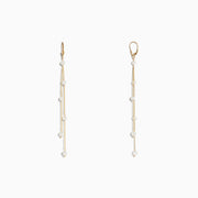 14K Yellow Gold Cultured Fresh Water Pearl Fringe Earrings featuring three delicate gold chains with spaced pearls, displayed on a plain white background.