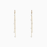 14K Yellow Gold Cultured Fresh Water Pearl Fringe Earrings featuring three delicate gold chains with spaced pearls, displayed on a plain white background.