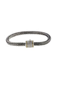 The 925 Sterling Silver and 18K Yellow Gold Diamond Bracelet (0.14 TCW) features a woven chain, square clasp with sparkling diamonds, and yellow gold accents, showcased against a white background.