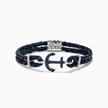 The Mens Sterling Silver Woven Leather Sapphire Anchor Bracelet, 0.52 TCW, features navy blue braided leather and a sterling silver anchor clasp set with sapphire gemstones.