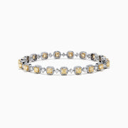 The Canare 18K Gold Yellow & White Diamond Tennis Bracelet, 4.71 TCW, showcases alternating square yellow and round white diamonds for a stunning, eye-catching pattern against a sleek white background.