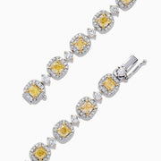 The Canare 18K Gold Yellow & White Diamond Tennis Bracelet, 4.71 TCW, showcases alternating square yellow and round white diamonds for a stunning, eye-catching pattern against a sleek white background.