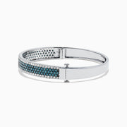 The Bella Bleu 14K White Gold Blue and White Diamond Bangle, 4.47 TCW, features three rows of round blue diamonds in the center, bordered by white diamonds along the edges, showcased on a plain white background.