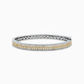 The Canare 14K Gold Yellow and White Diamond Bangle, 3.40 TCW, showcases a central row of yellow and white diamonds in an elegant geometric design inspired by Effy—an eye-catching gold statement piece.