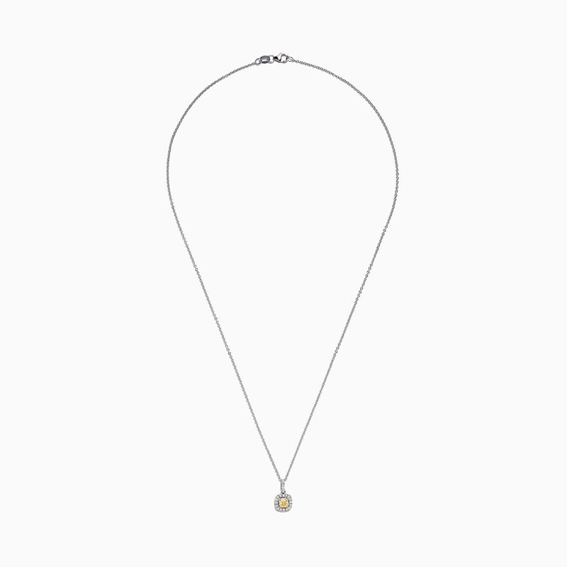 The Canare 18K Two-Tone Gold Cushion Cut Yellow Diamond Pendant (0.52 TCW) features a yellow diamond in a cushion cut, haloed by clear stones and suspended from a fine two-tone gold chain.