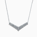 The 925 Sterling Silver Diamond Necklace features a V-shaped pendant with two rows of round diamonds, set at the chain’s base for maximum brilliance and a total carat weight of 0.47 TCW.