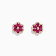 Ruby Royale 14K Yellow Gold Ruby Flower Stud Earrings, 3.18 TCW, feature bloom-shaped studs with six deep pink ruby petals encircling small clear stones and a central stone, all set in gold-tone metal.