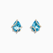Ocean Bleu 14K Yellow Gold Earrings feature pear-shaped blue topaz and crisscrossing diamond accents, totaling 9.70 TCW.