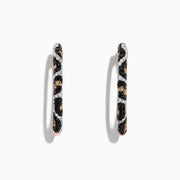 A pair of 14K rose gold hoop earrings featuring leopard spots and 0.78 TCW diamonds in black, brown, and white, set against a white background.
