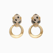 The Signature 14K Yellow Gold Diamond Emerald Panther Earrings, 0.93 TCW, feature leopard head designs with sparkling diamonds and green emerald eyes, each holding a smooth gold hoop in its mouth.