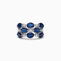 This elegant 14K white gold ring features alternating oval blue sapphires and round white diamonds, totaling 4.66 carats, for a striking look.