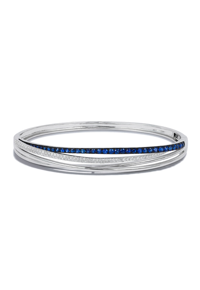 The Royale Bleu 14K White Gold Blue Sapphire & Diamond Bangle features a single row of blue sapphires and diamonds, totaling 1.47 TCW, set along the center for sleek elegance.
