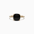The Eclipse 14K Yellow Gold Diamond and Onyx Ring, 1.40 TCW, showcases a large cushion-cut black onyx set in four prongs on a slim gold band accented with sparkling white diamonds.