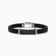 The Mens Sterling Silver Black Spinel Leather Bracelet, 2.11 TCW, features a black braided leather band with a rectangular silver clasp and center bar set with small black spinels, plus geometric details on the silver accents.