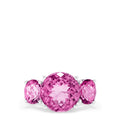 The 14K White Gold Pink Topaz Three Stone Ring, 8.00 TCW, showcases a brilliant round center pink topaz flanked by two smaller rounds, all set in luminous white gold for a stunning look.