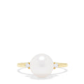 The 14K Yellow Gold Cultured Pearl and Diamond Accented Ring, 0.05 TCW, features a large round cultured pearl at the center with diamond accents on each side, shown on a plain white background.