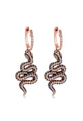 The Nature 14K Rose Gold Espresso and White Diamond Snake Earrings feature dangling snake designs with green gemstone eyes and a sparkling 1.57 TCW of brown, black, and white diamonds for added brilliance.