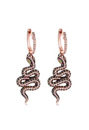 The Nature 14K Rose Gold Espresso and White Diamond Snake Earrings feature dangling snake designs with green gemstone eyes and a sparkling 1.57 TCW of brown, black, and white diamonds for added brilliance.