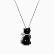 The Safari 14K White Gold Onyx and Diamond Cat Pendant (5.35 TCW) features a sitting cat design with onyx accents and sparkling diamond details, plus a blue gemstone collar, all set against a plain white background.