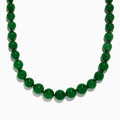 A close-up of a 14K Yellow Gold Jade Necklace, 339.00 TW, arranged in a curved shape against a white background.