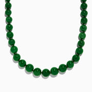 A close-up of a 14K Yellow Gold Jade Necklace, 339.00 TW, arranged in a curved shape against a white background.