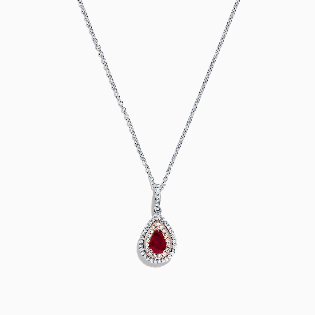 The Ruby Royale 14K Two Tone Gold Pear Shaped Ruby Pendant (0.68 TCW) features a stunning ruby, accented by small clear stones, showcased on a white background.