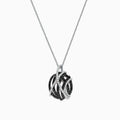 The 14K White Gold Black and White Diamond Pendant (0.92 TCW) showcases interwoven curves with black and white diamonds, creating a modern, elegant look on a delicate silver chain.