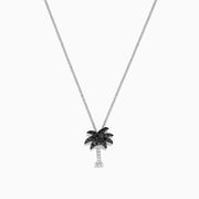 A Novelty 14K Gold Palm Tree Pendant with 0.27 TCW black and white diamonds, displayed on a fine chain against a white background.