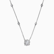 The Bouquet 14K White Gold Diamond Station Cluster Pendant Necklace, 0.82 TCW, showcases a large round diamond pendant and four bezel-set diamonds along the chain, beautifully displayed on a white background.