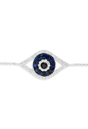 The Novelty 14K White Gold Sapphire & Diamond Evil Eye Bracelet, 0.43 TCW, features a central eye charm set with blue sapphires and diamonds on a fine chain with lobster clasp. Shown on a plain white background.