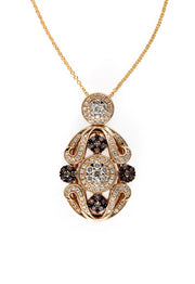 The 14K Yellow Gold Diamond Filigree Pendant features ornate scrollwork with white and dark diamonds totaling 1.04 TCW, all set in luminous yellow gold against a white background.