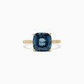 The Ocean Bleu 14K yellow gold ring boasts a cushion-cut London Blue Topaz centerpiece and sparkling round diamonds along the band, totaling 4.54 TCW.