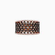 The 14K Rose Gold Espresso and White Diamond Ring features rows of small black (espresso) and orange gemstones in a lattice pattern, bordered by white diamonds, with a total carat weight of 1.25 TCW.