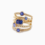 The Nahla Siri 14K Yellow Gold Tanzanite and Diamond Ring, 2.26 TCW, features five uniquely shaped blue tanzanites and shimmering round diamonds set along the multi-band design for extra sparkle.