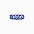 The Nahla Siri Sterling Silver Tanzanite Band Ring, 2.14 TCW, features five oval tanzanite gemstones in a row, each secured by four prongs and showcased against a white background.