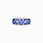 The Nahla Siri Sterling Silver Tanzanite Band Ring, 2.14 TCW, features five oval tanzanite gemstones in a row, each secured by four prongs and showcased against a white background.