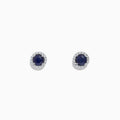 The Royale Bleu 14K White Gold Sapphire & Diamond Stud Earrings, 1.27 TCW, feature deep blue round sapphires encircled by a halo of diamonds and are shown on a white background.