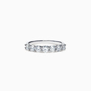 The Pave Classica 14K White Gold Diamond Band 1.03 TCW showcases seven round diamonds in a sleek, minimalist white gold band, elegantly presented against a plain white background.