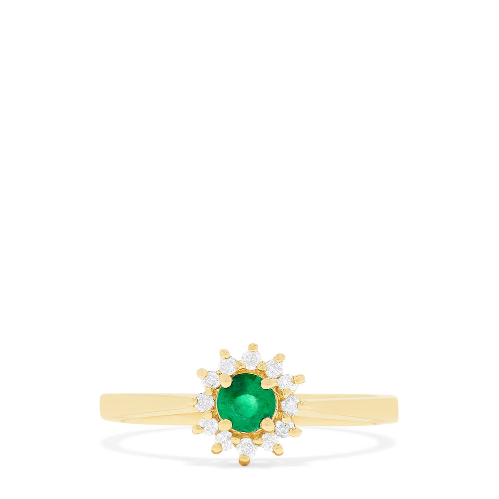 The 14K Yellow Gold Emerald and Diamond Ring, 0.36 TCW, showcases a round emerald center accented by a floral halo of sparkling white diamonds.