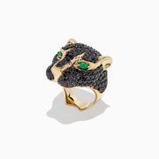 The Collectors Edition 14K Yellow Gold Black Diamond Ring, 3.80 TCW, features a panther head design with black diamonds and vivid green eyes, elegantly showcased against a plain white background.