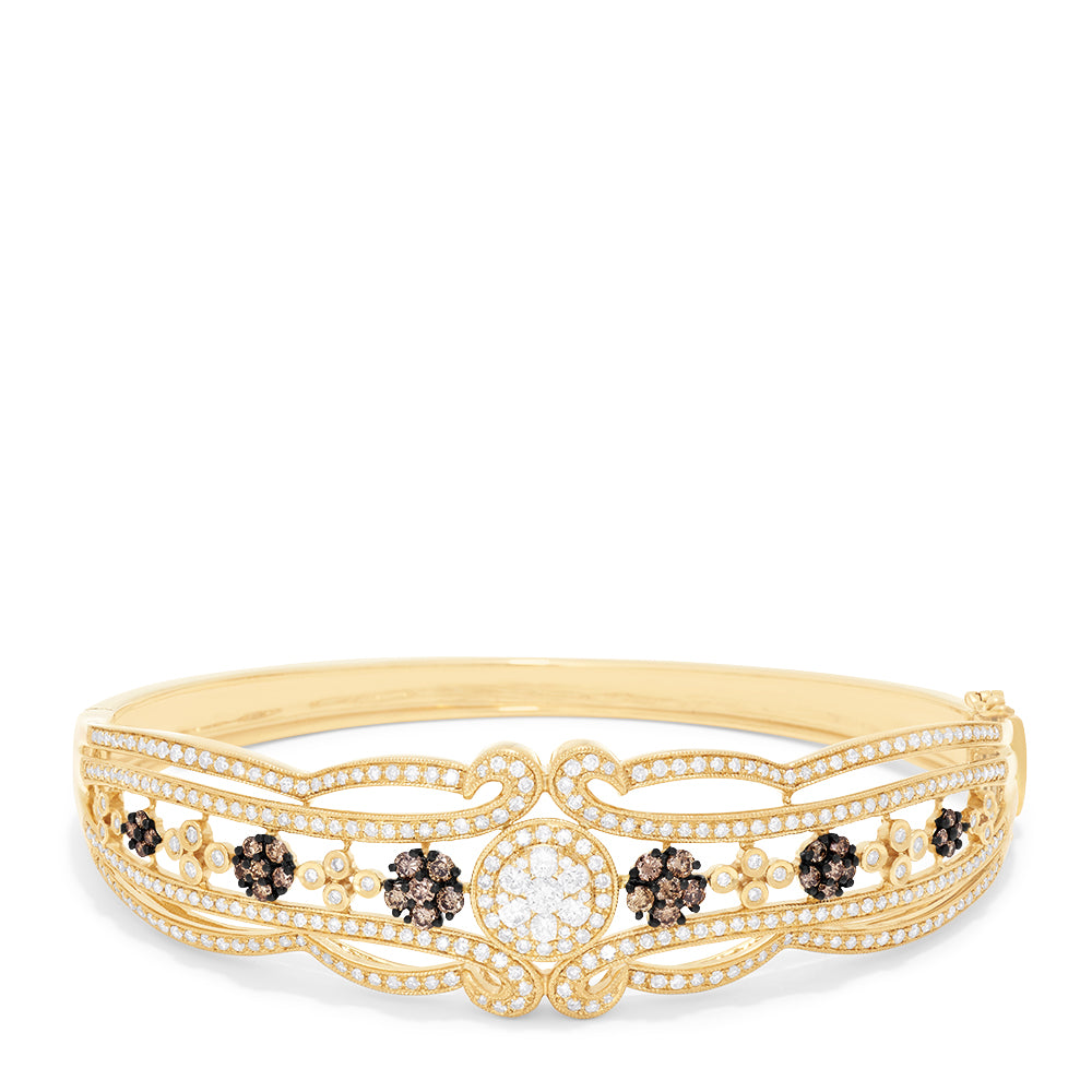 The 14K Yellow Gold Diamond Filigree Bangle, 2.03 TCW, features intricate filigree patterns and sparkling diamond clusters, elegantly detailed along the band.