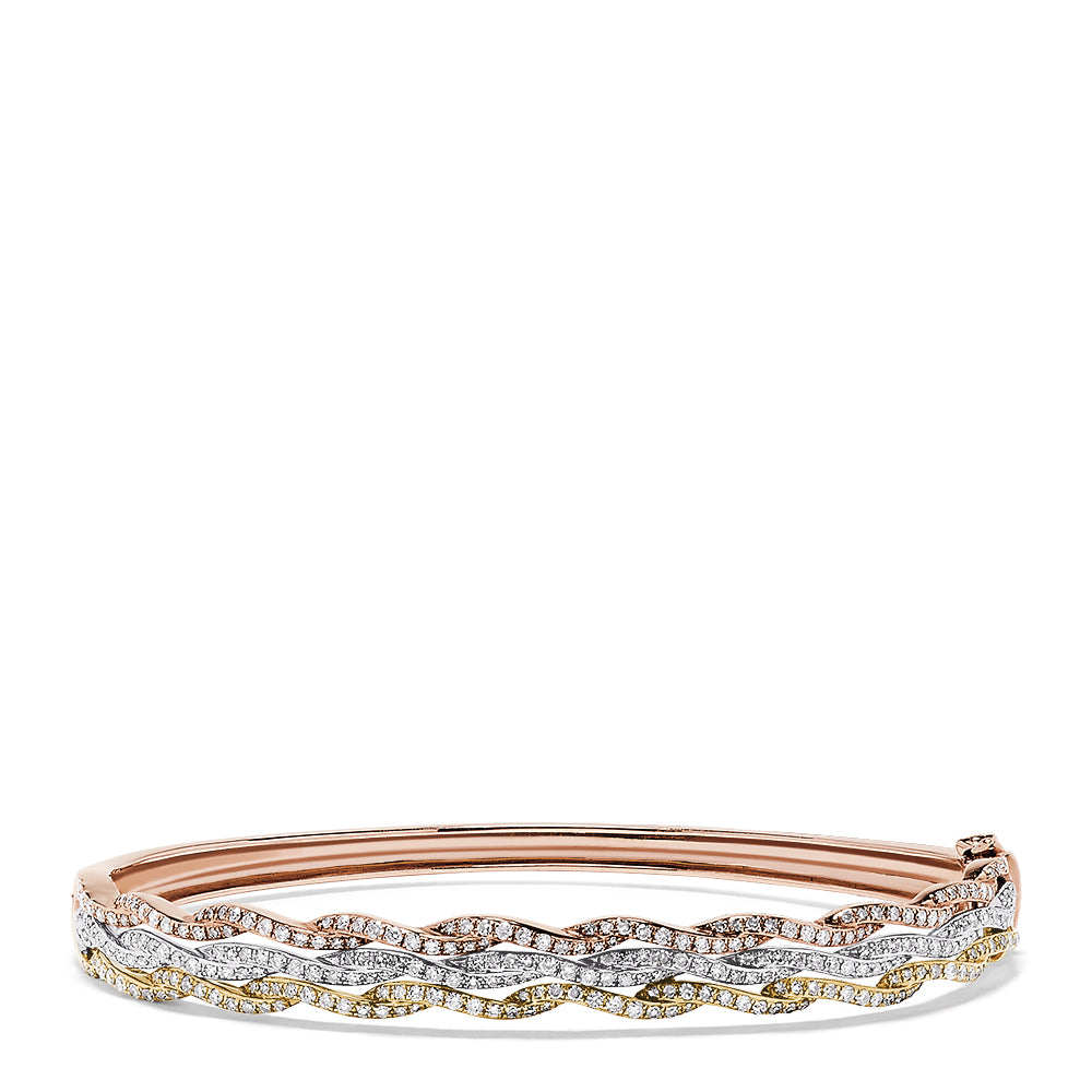 The Trio 14K Tri Color Gold Diamond Bangle, 1.42 TCW, showcases three wavy rows of white and yellow diamonds set in rose, white, and yellow gold for a brilliant, elegant look.