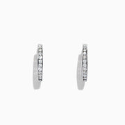 The Pave Classica 14K White Gold Channel-Set Diamond Hoop Earrings, 0.48 TCW, feature small round diamonds encrusted in a channel-set design along the outer edge, shown against a plain white background.